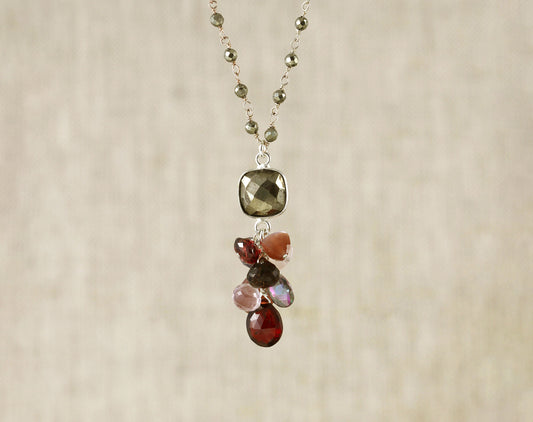 Sterling silver necklace with colorful gemstones.