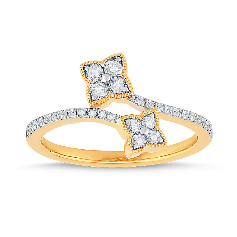 Yellow gold ring with diamond floral design.