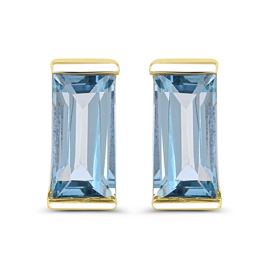 Baguette blue topaz earrings in yellow gold.