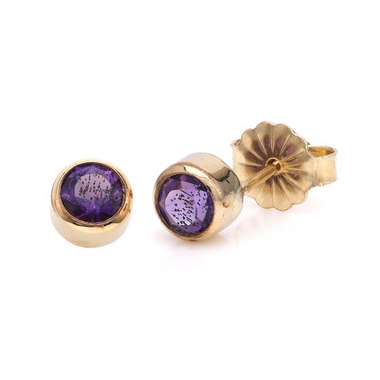 14K gold stud earrings with round amethysts.