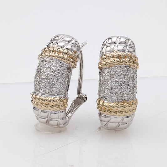 Sterling silver diamond cuff earrings.