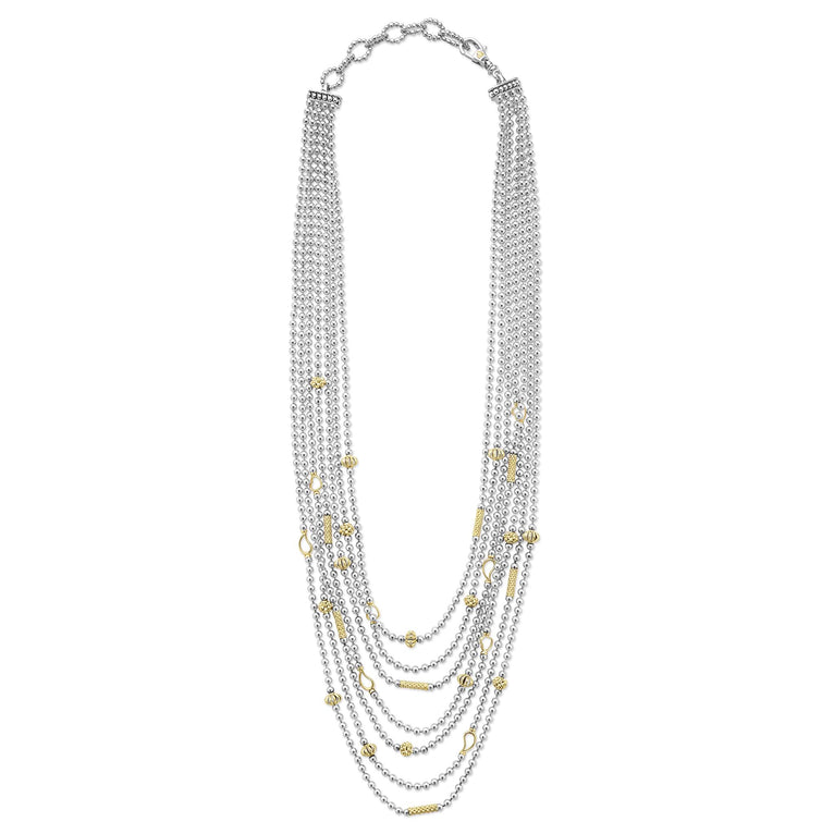 Sterling silver layered necklace with gold accents.