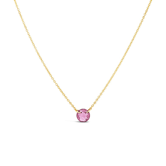 Gold necklace with round pink topaz pendant.