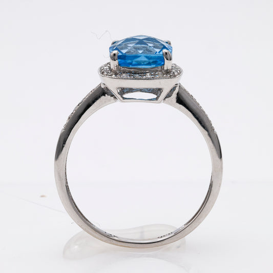 Cushion Blue Topaz ring with diamonds.