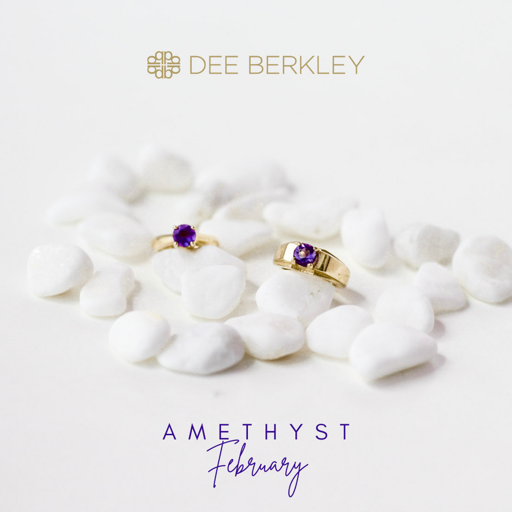 Amethyst rings on white stones.