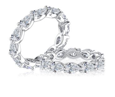 14K white gold band with pear diamonds.