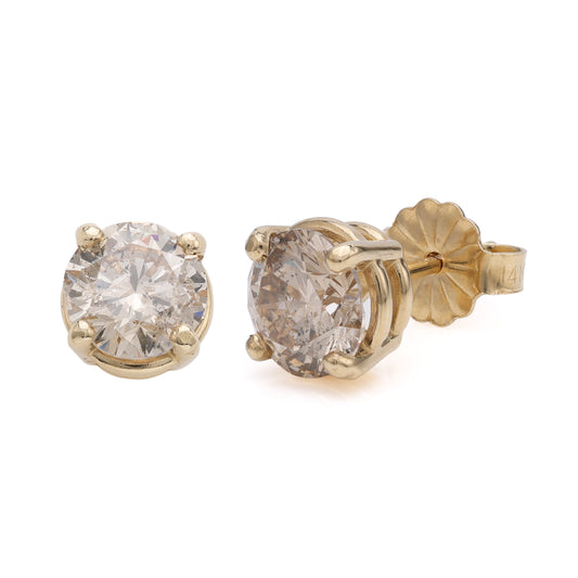 Brown diamond stud earrings, yellow gold setting.