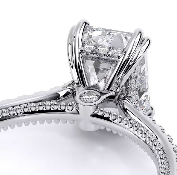 White gold ring with round diamond accents.