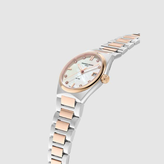 Stainless steel watch with mother of pearl dial.