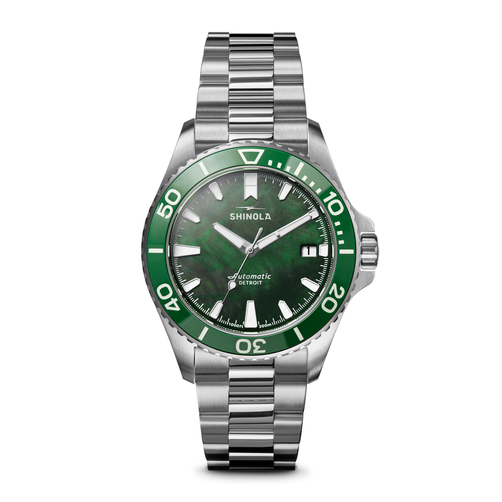 Green dial stainless steel automatic watch.