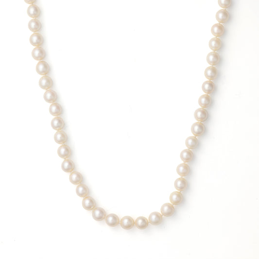 Pearl strand necklace with white gold clasp.