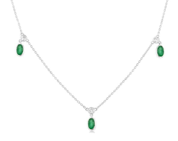 Oval emerald and diamond station necklace.