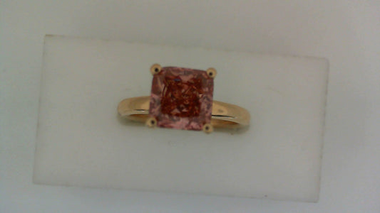 Pink cushion-cut diamond ring in rose gold.