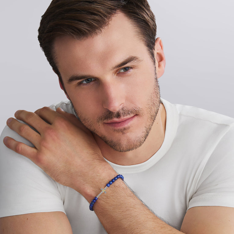 Blue lapis stretch bracelet with silver accents.