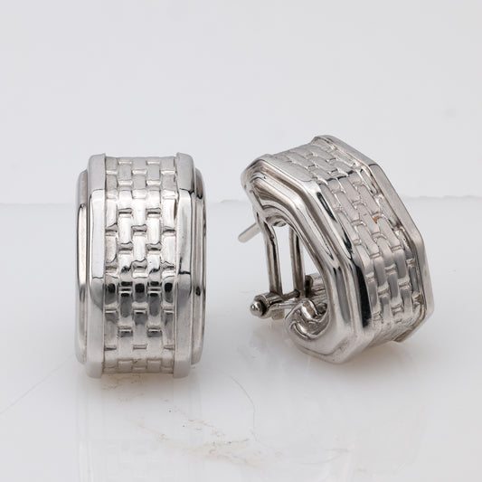 14K white gold textured huggie earrings.