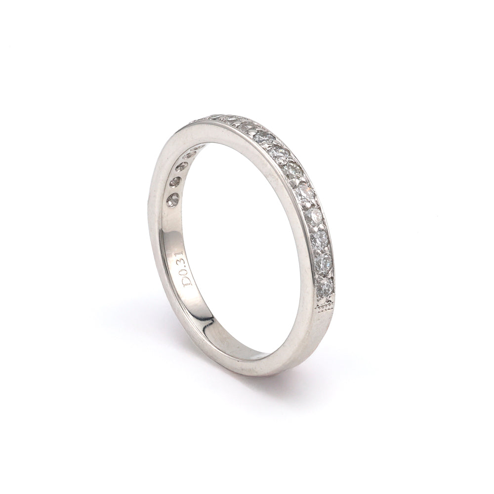 Platinum diamond wedding band with round stones.