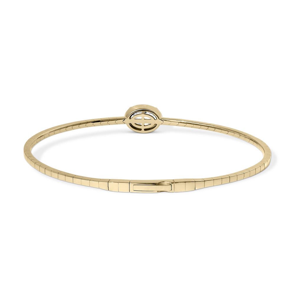 18K yellow gold bangle with oval diamond.