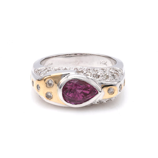 Pear-shaped pink sapphire ring with diamonds.