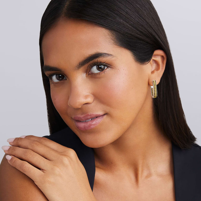 Sterling silver oval hoop earrings, beaded design.
