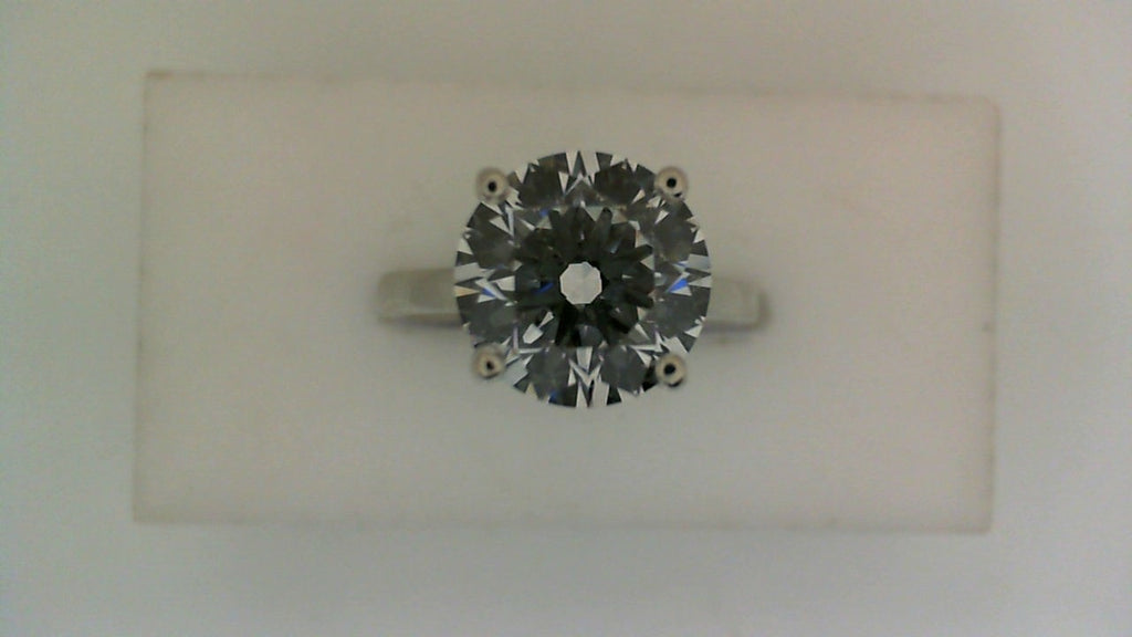 Solitaire lab-grown diamond engagement ring.