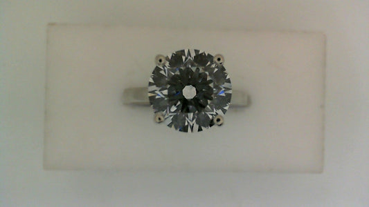 Solitaire lab-grown diamond engagement ring.