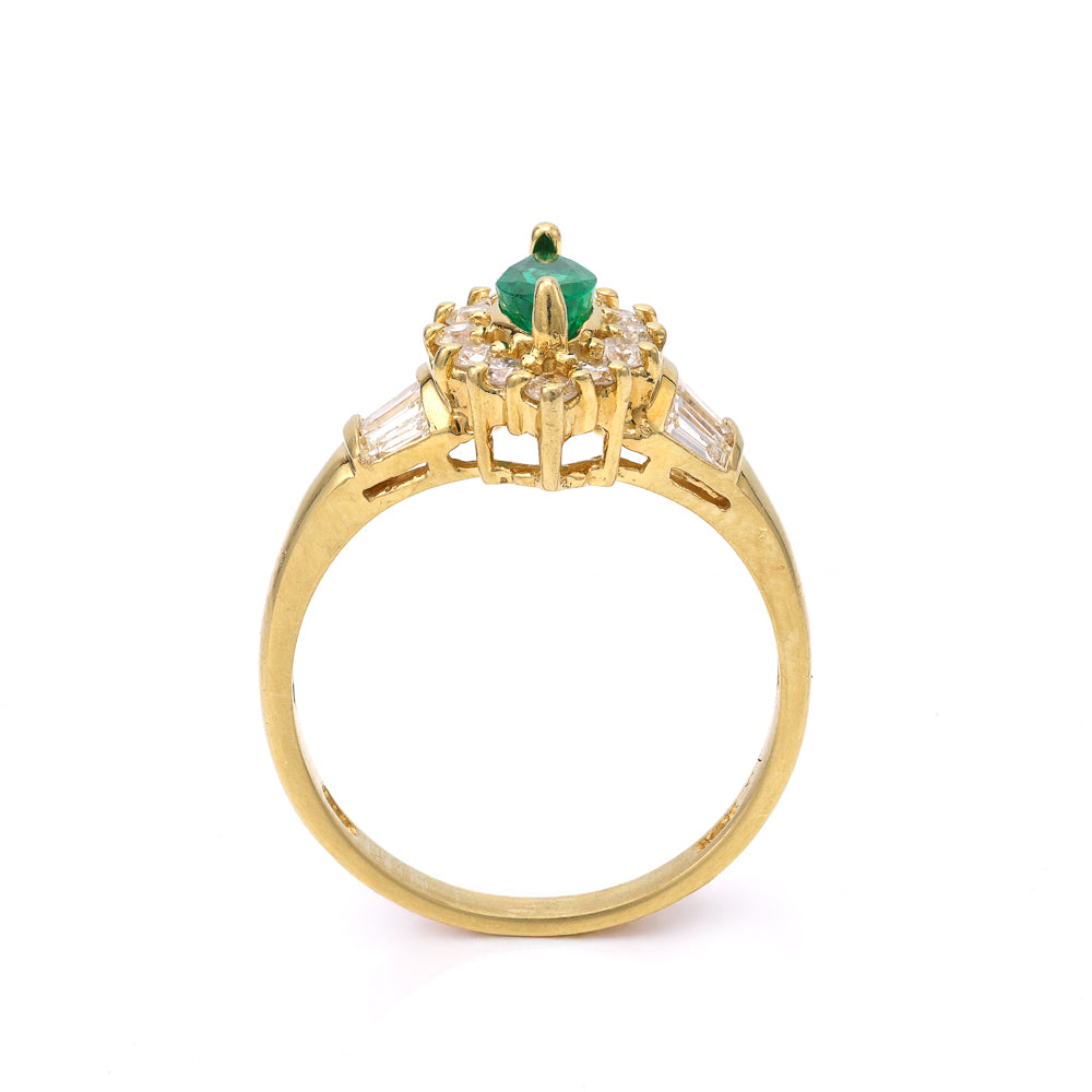 18K gold ring with emerald centerpiece.