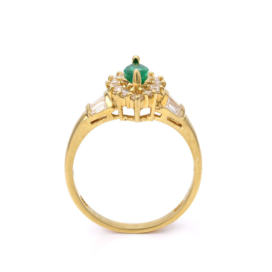 18K gold ring with emerald centerpiece.