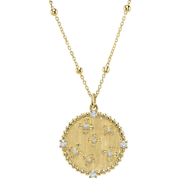 Gold pendant necklace with diamond accents.