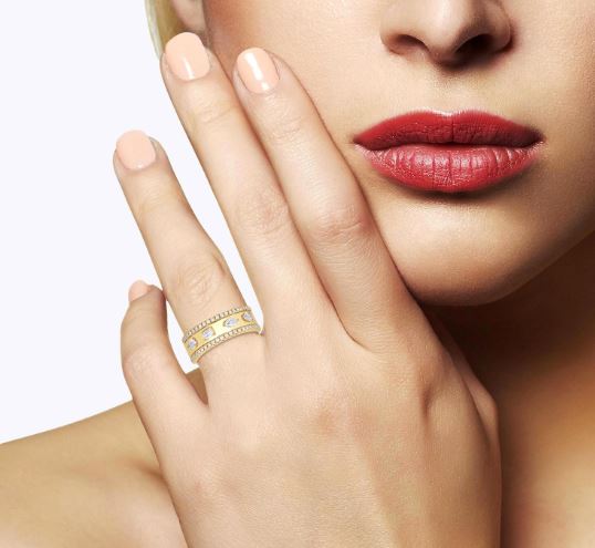Yellow gold ring with various shaped diamonds.