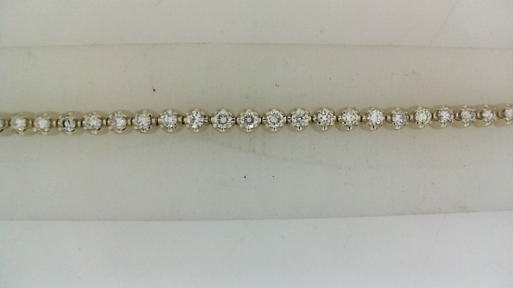 Diamond bracelet with round gemstones, elegant design.