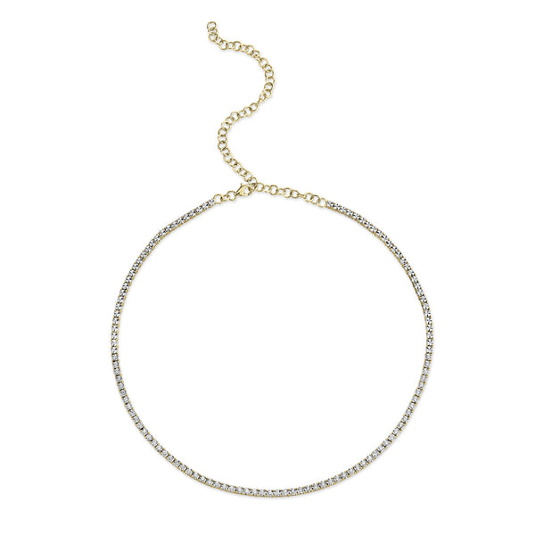 Gold chain necklace with round diamonds.