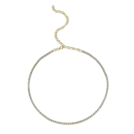 Gold chain necklace with round diamonds.