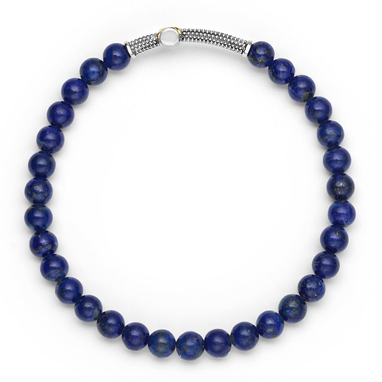Blue lapis stretch bracelet with silver accents.