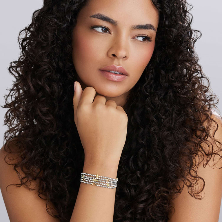 Sterling silver multi-strand bracelet, gold accents.