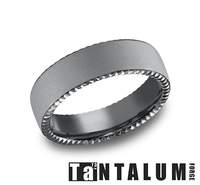 Dark grey tantalum carved band, satin finish.