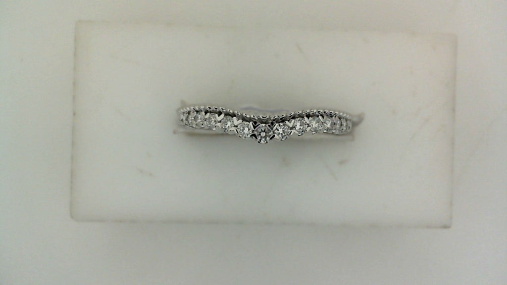 Contour wedding band with round diamonds.