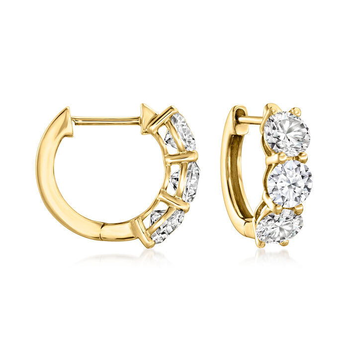 14K gold huggie earrings with round diamonds.