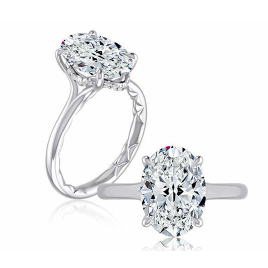Oval diamond ring with hidden accent diamonds.
