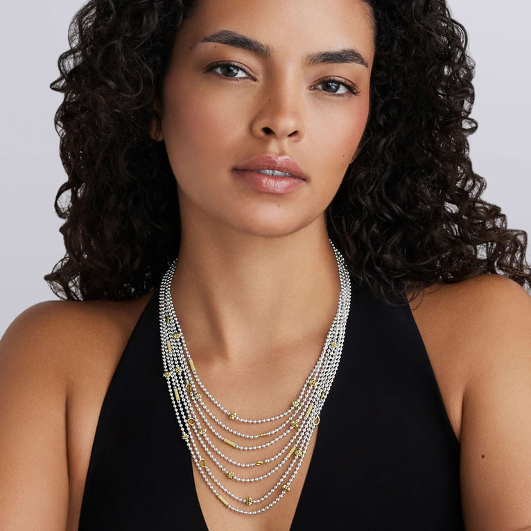 Sterling silver layered necklace, gold accents.