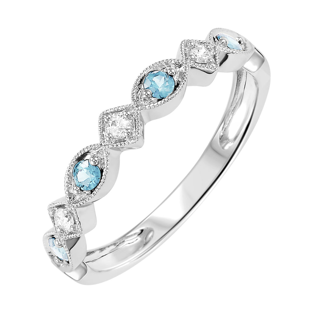 Blue topaz and diamond band in white gold.