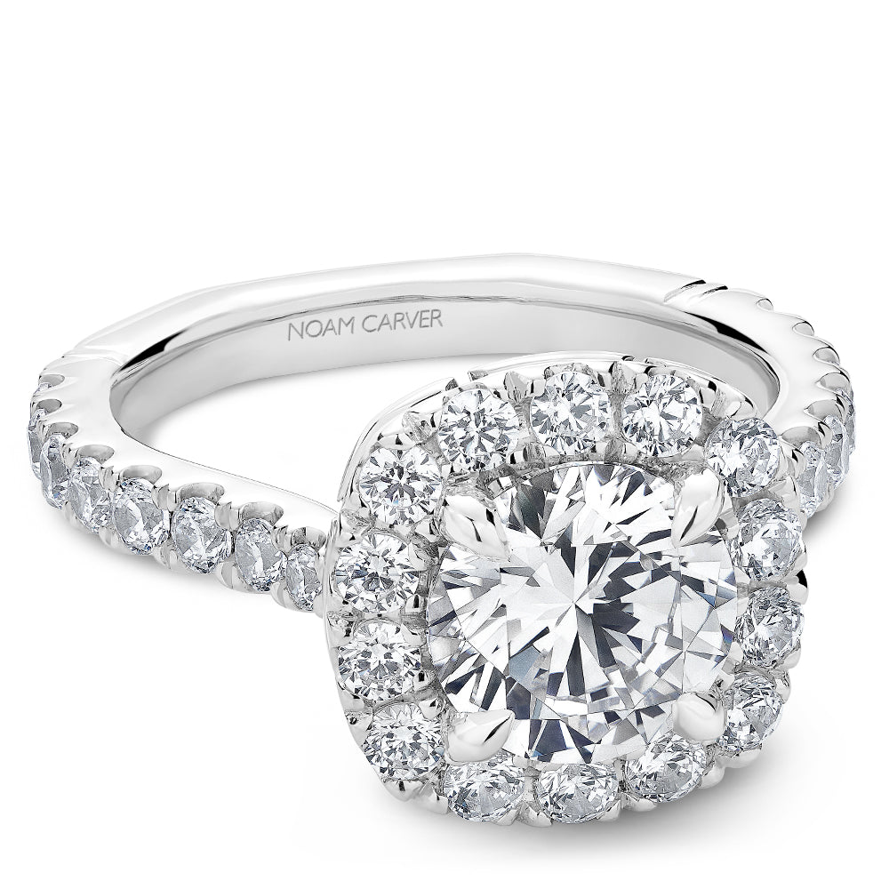 Halo diamond ring with side stones.