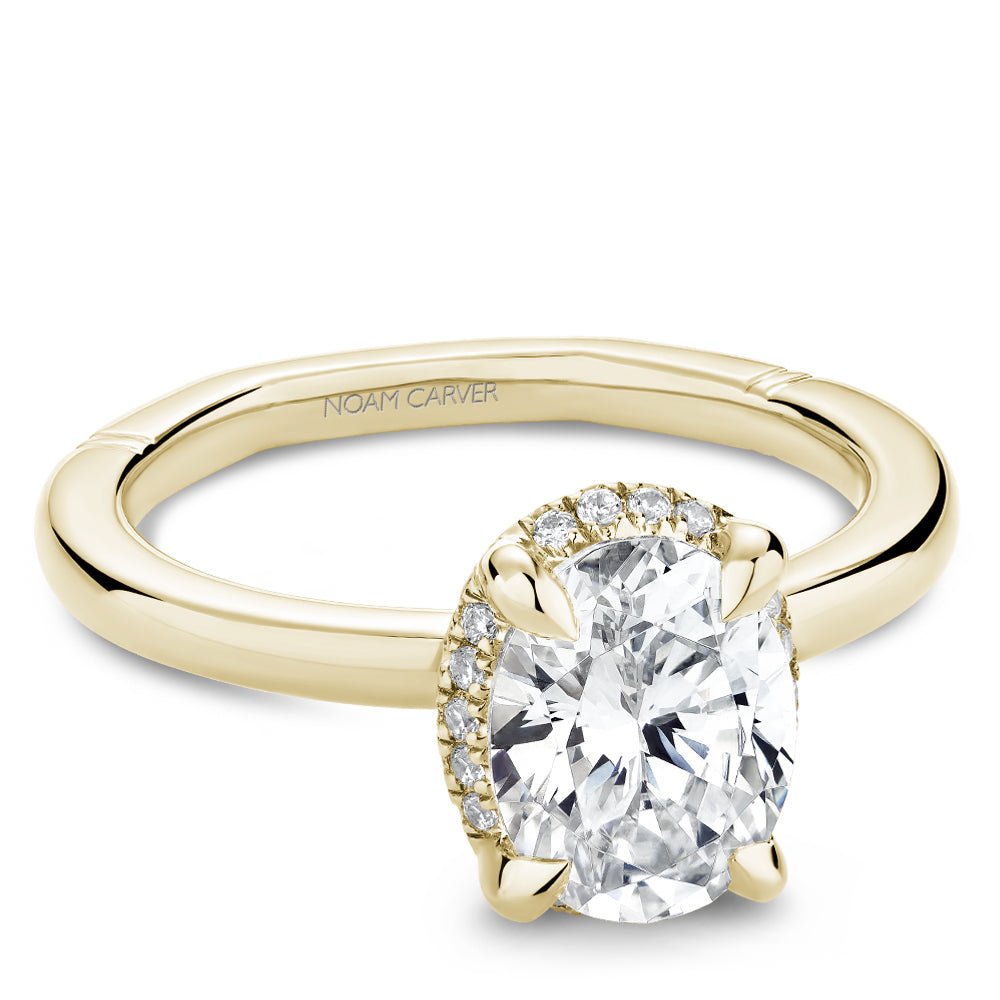 Halo diamond ring in yellow gold.