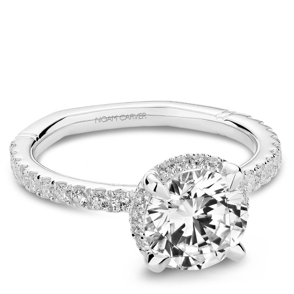 Halo diamond ring with side stones.