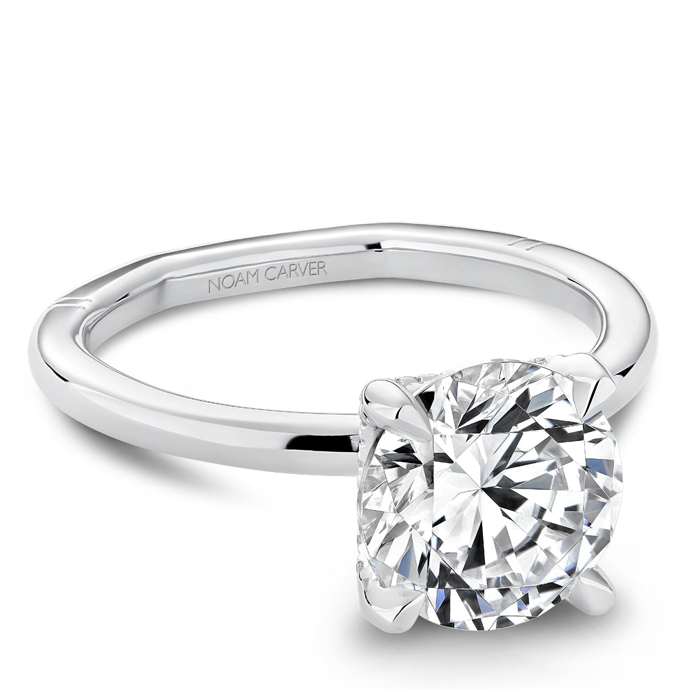 Solitaire diamond ring with hidden accents.