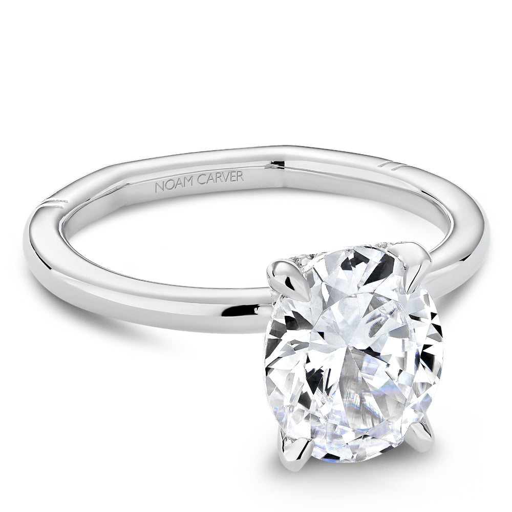 Solitaire diamond ring with hidden accents.