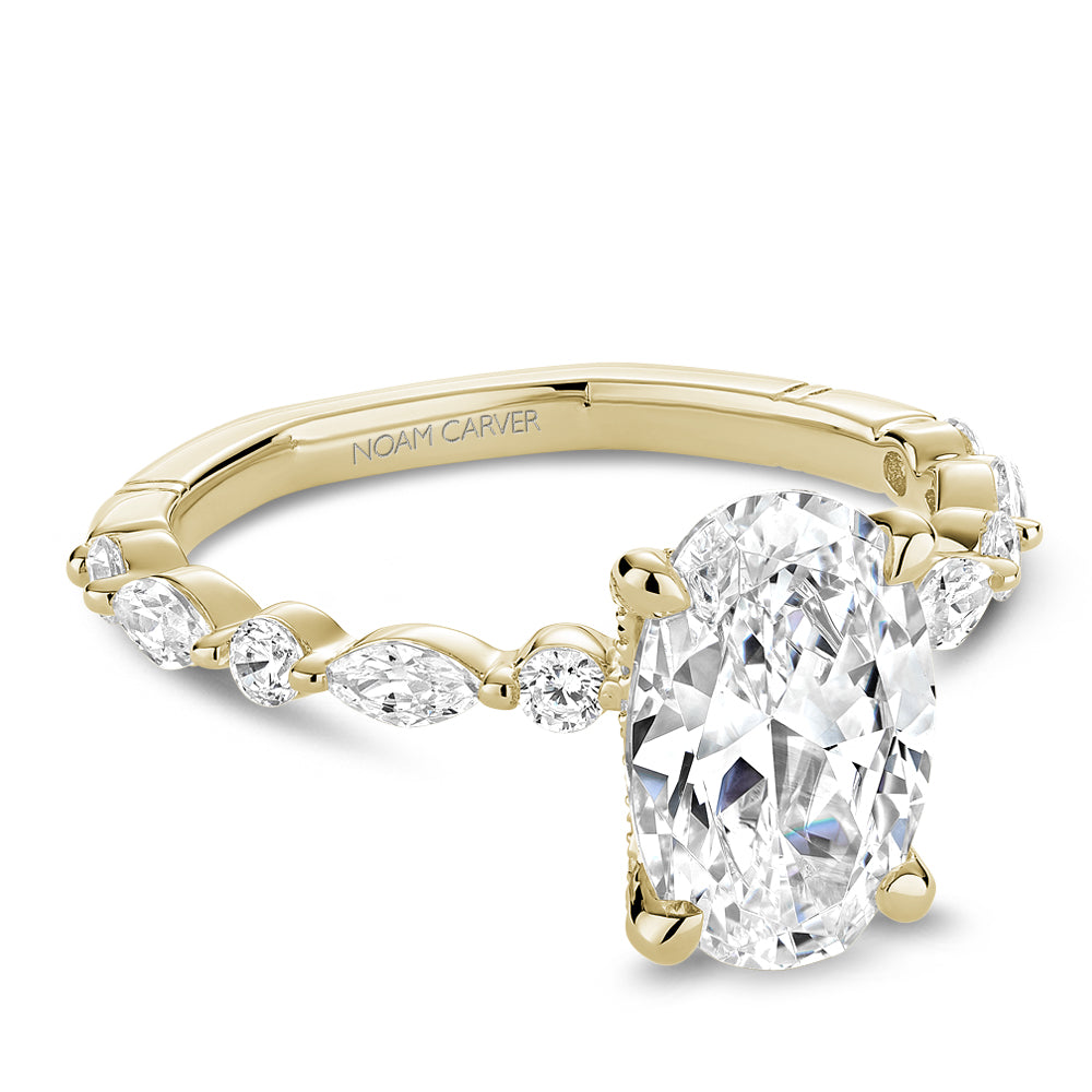 Yellow gold ring with marquise and round diamonds.