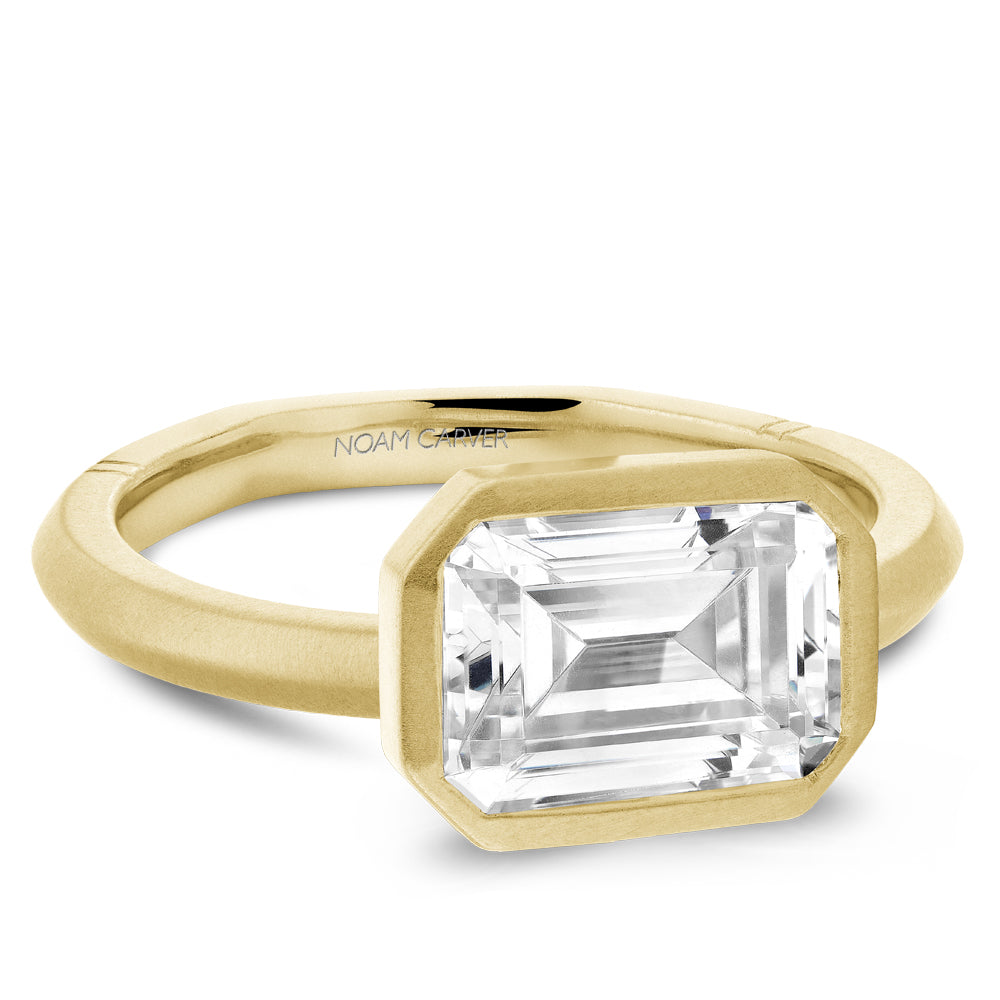Emerald-cut diamond, yellow gold solitaire ring.