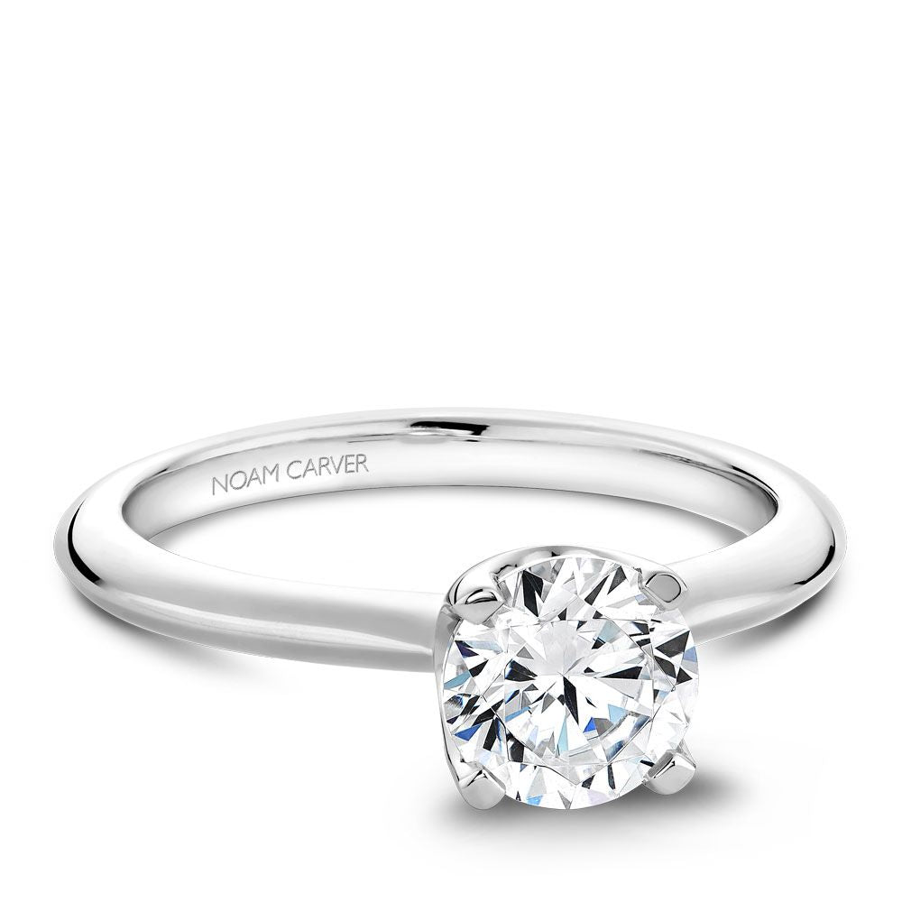 Solitaire ring, 14K white gold setting.