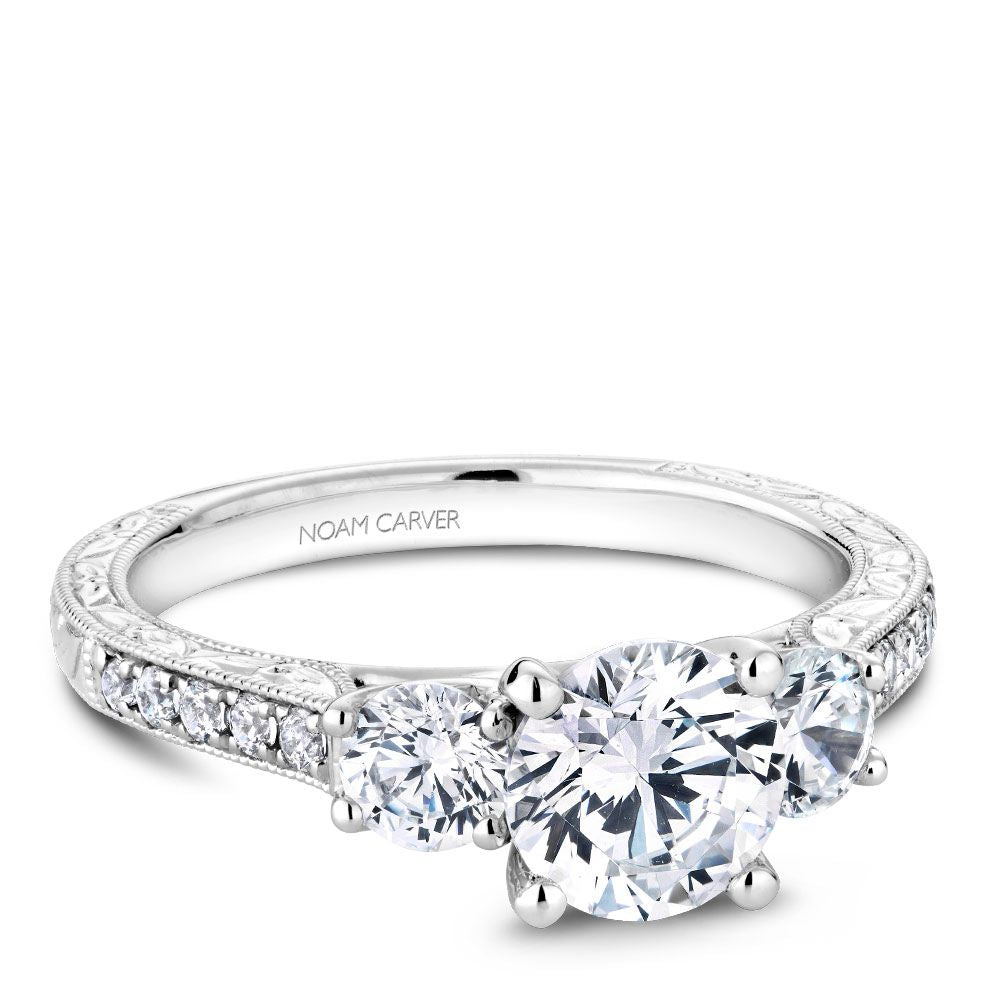 Three-stone diamond ring, white gold band.