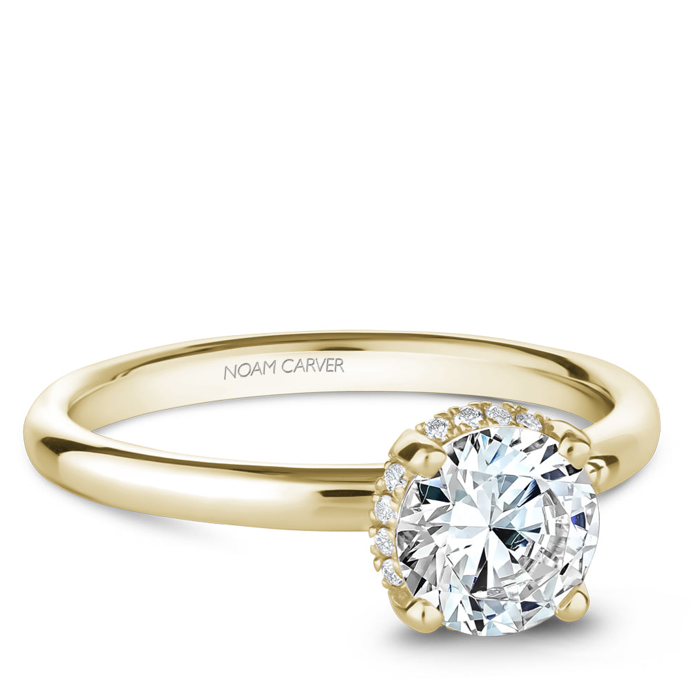 Yellow gold ring with round diamond accents.